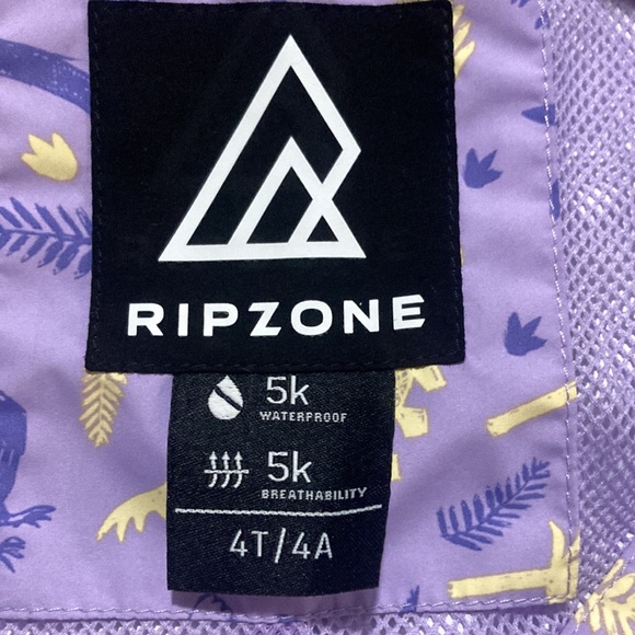Ripzone light purple with purple and yellow dinosaurs on it rain jacket - Picture 3 of 4